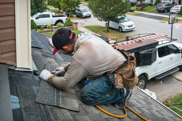 Professional Roof Repair technician working in Barton, OH